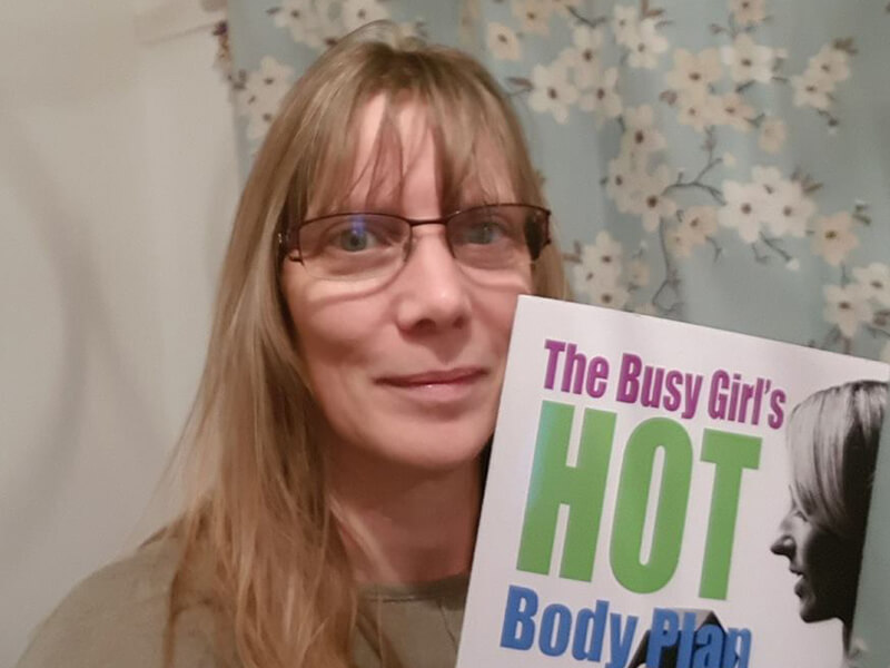 Jodie holding The Busy Girl's HOT Body Plan