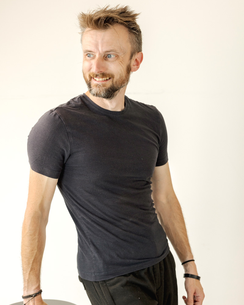 Professional portrait of Anthony Punshon looking to the right